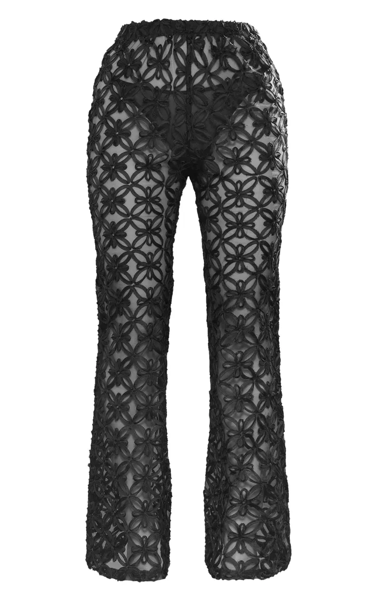 Pantalon flare en maille tissée noire transparente